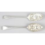 Two George III silver berry spoons, together with a William IV silver fish slice. (3).