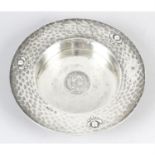 An Edwardian silver circular dish with inset George III Crown.