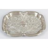 An Edwardian silver Art Nouveau style dressing table tray, together with two silver topped glass