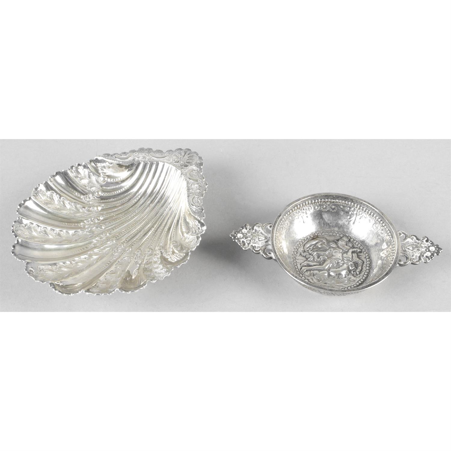 A late Victorian silver butter dish, together with a small wine taster. (2).