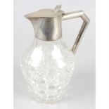 An Edwardian silver mounted and cut glass jug.