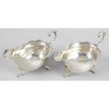 A near pair of George V silver sauce boats.