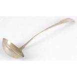 A George III Scottish silver soup ladle.