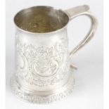 A George III silver mug with later decoration.