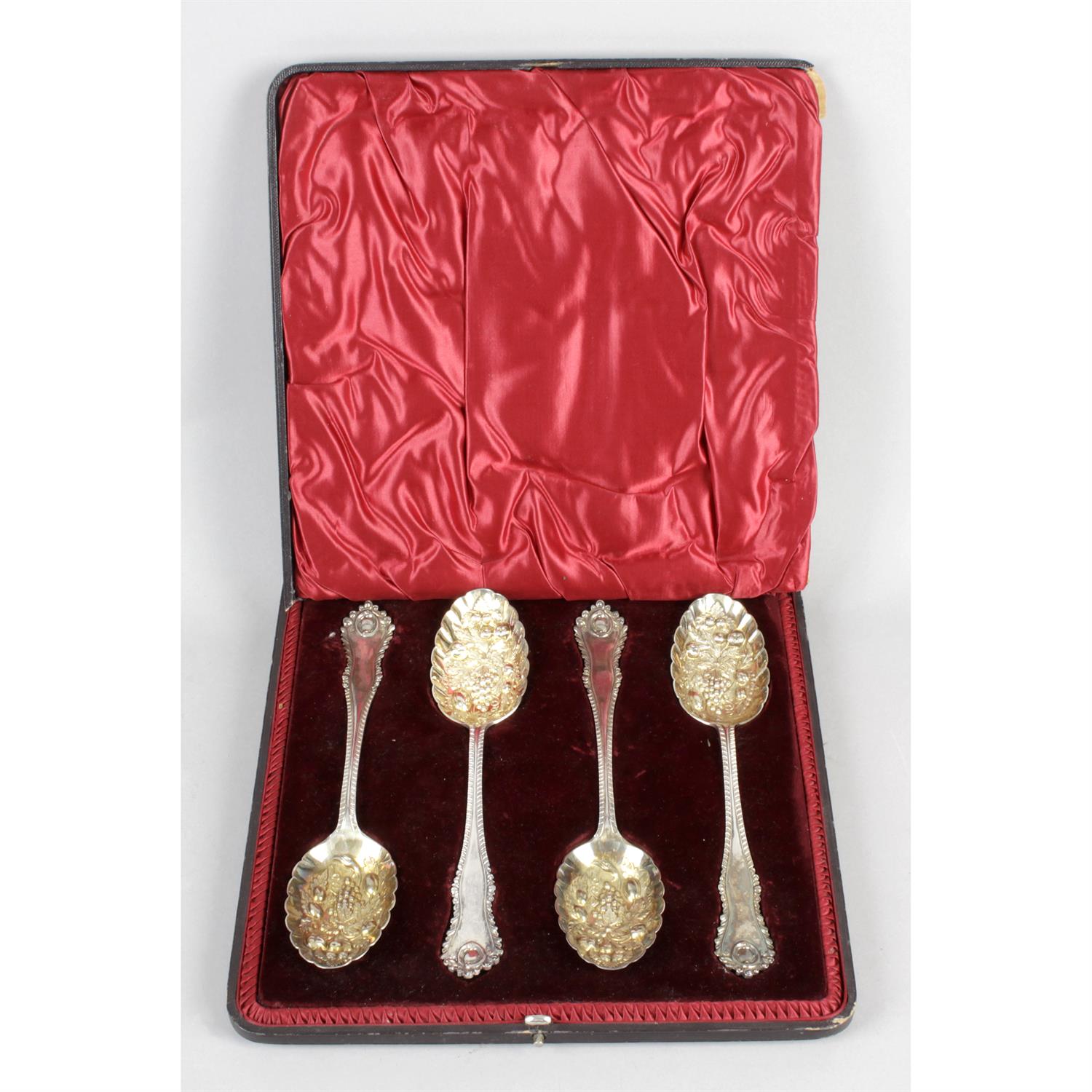 A cased set of four late Victorian silver fruit serving spoons.
