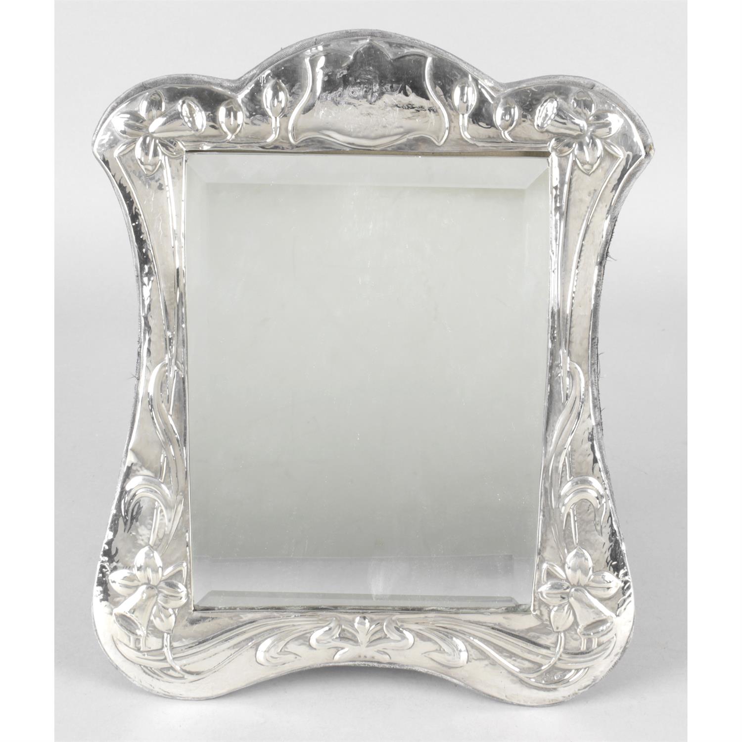 A modern Britannia silver mounted mirror with Art Nouveau style decoration.