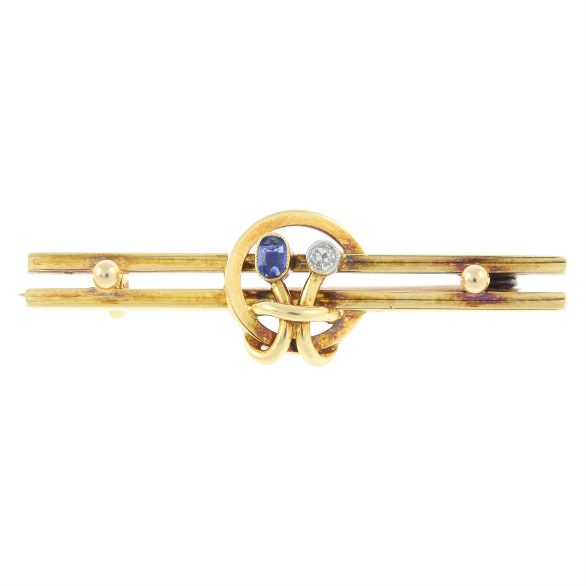 An early 20th century gold sapphire and diamond bar brooch.