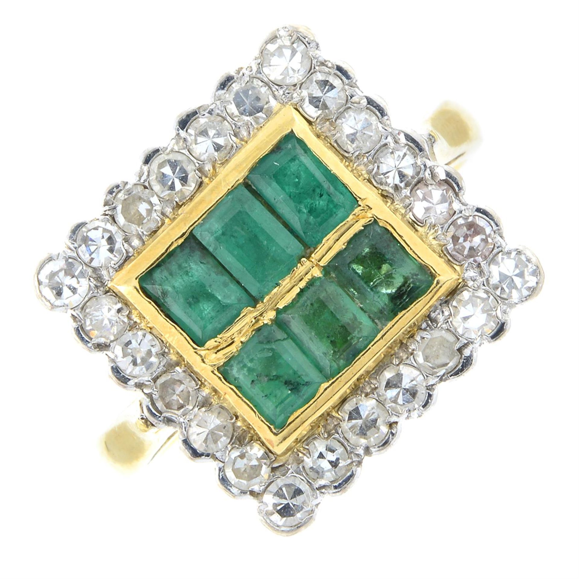 An 18ct gold emerald and diamond dress ring.