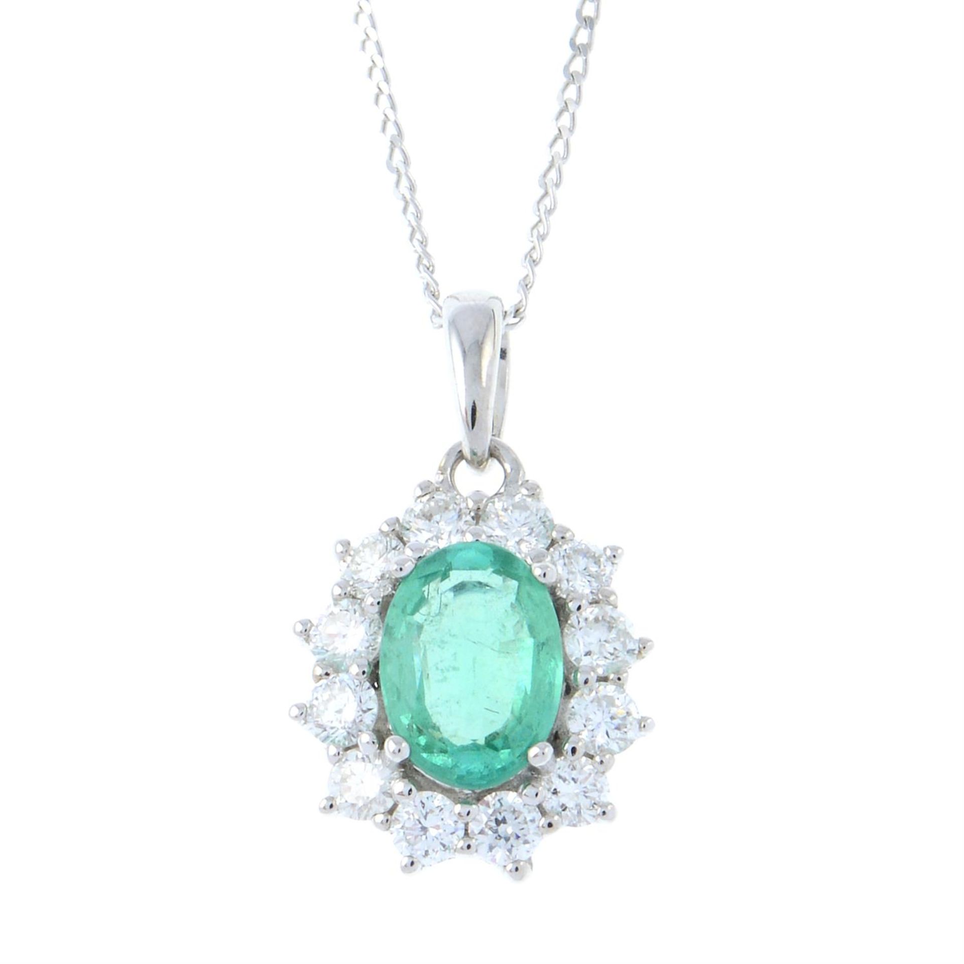 An 18ct gold emerald and brilliant-cut diamond cluster pendant, with chain.