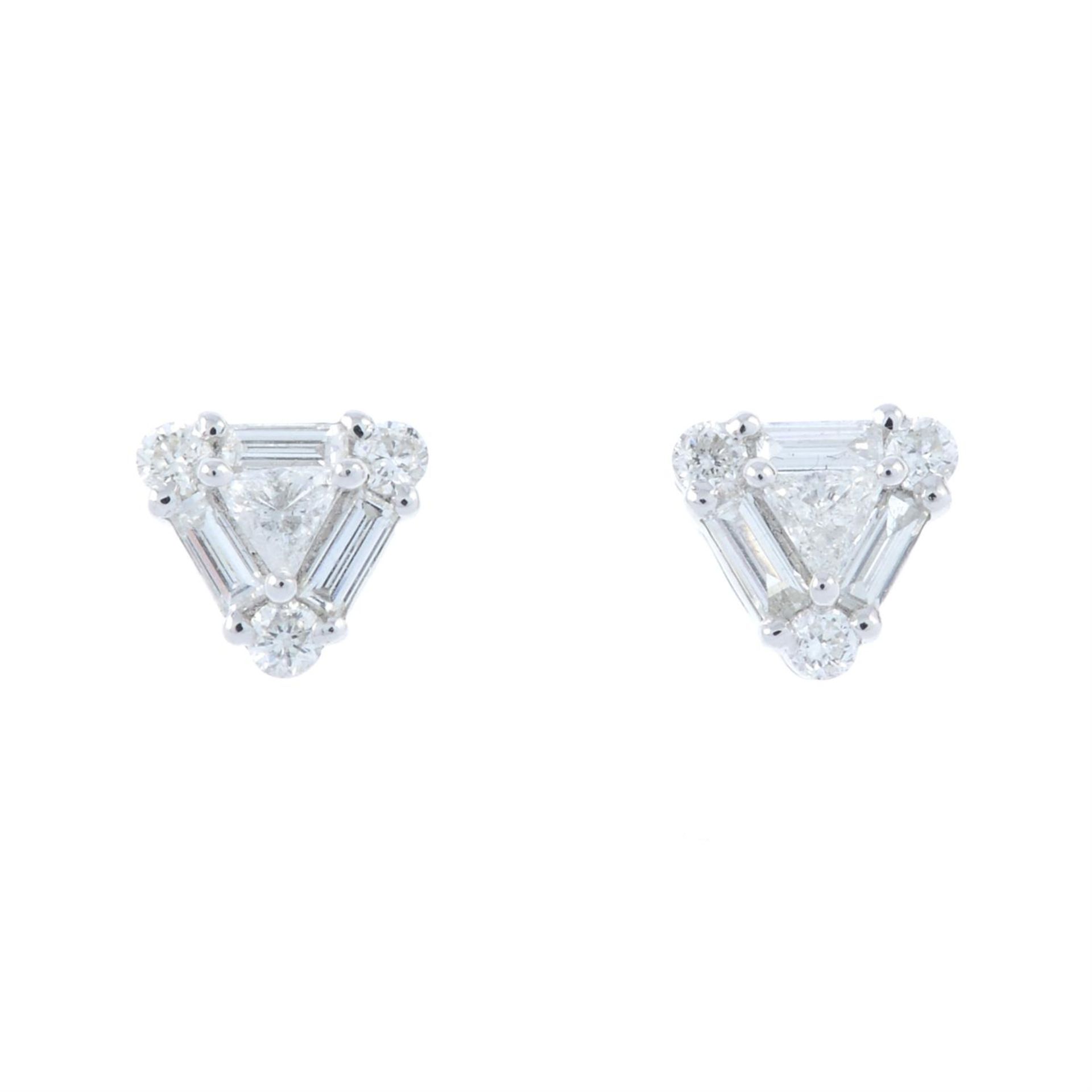 A pair of vari-cut diamond cluster earrings.