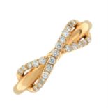 An 18ct gold infinity ring, with brilliant-cut diamond highlights.