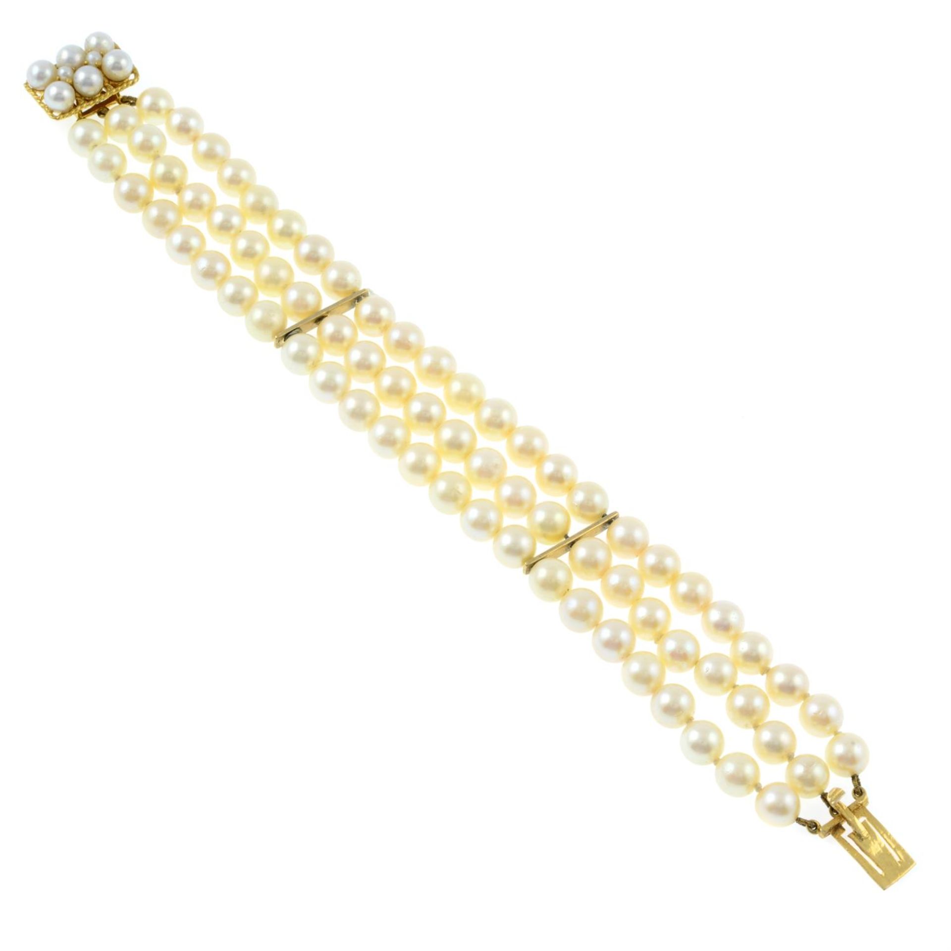 A three-row cultured pearl bracelet, with cultured pearl cluster push-piece clasp.