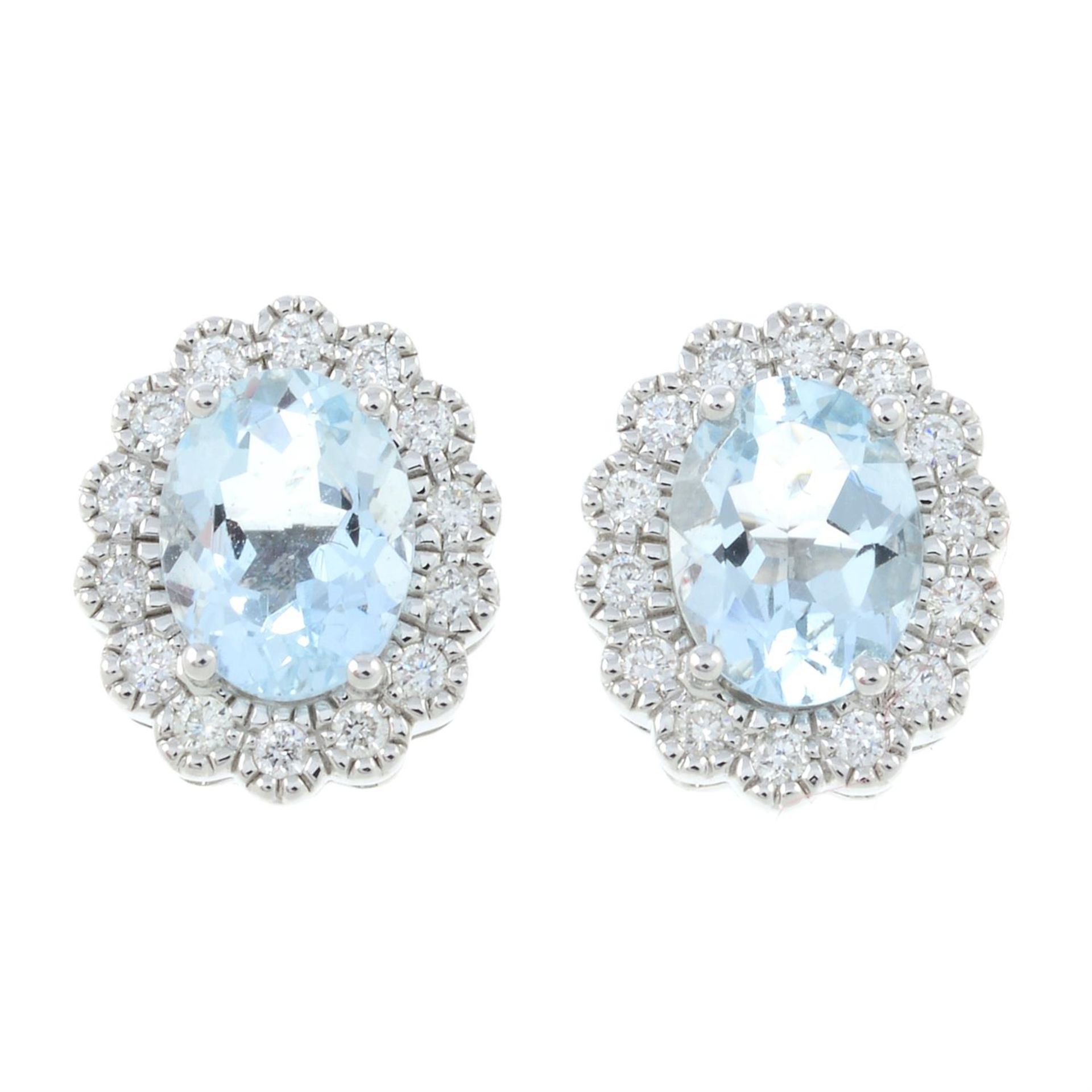 A pair of 18ct gold aquamarine and diamond cluster earrings.