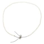 A cultured pearl necklace, with cubic zirconia bow detail.