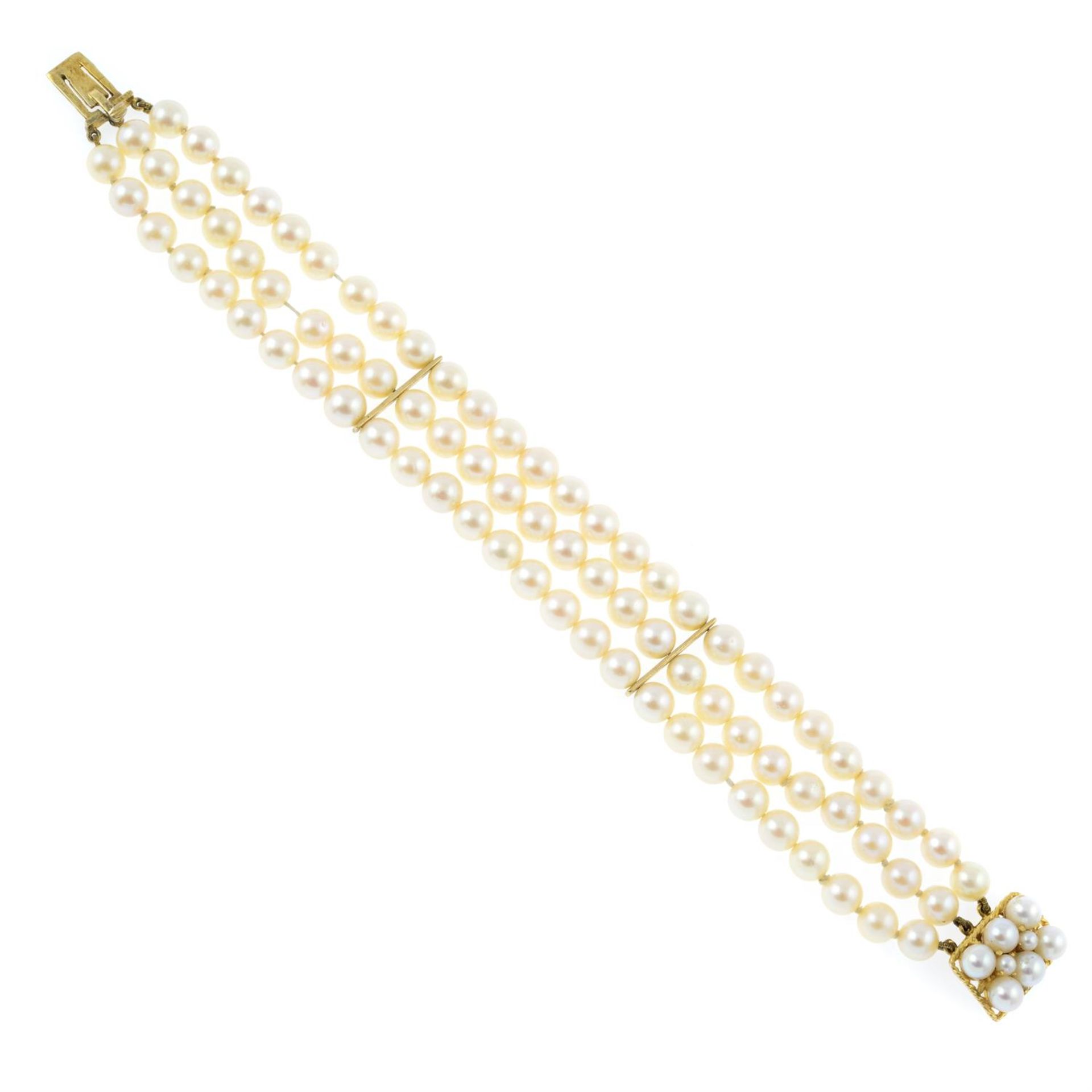 A cultured pearl three-row bracelet, with push-piece clasp.