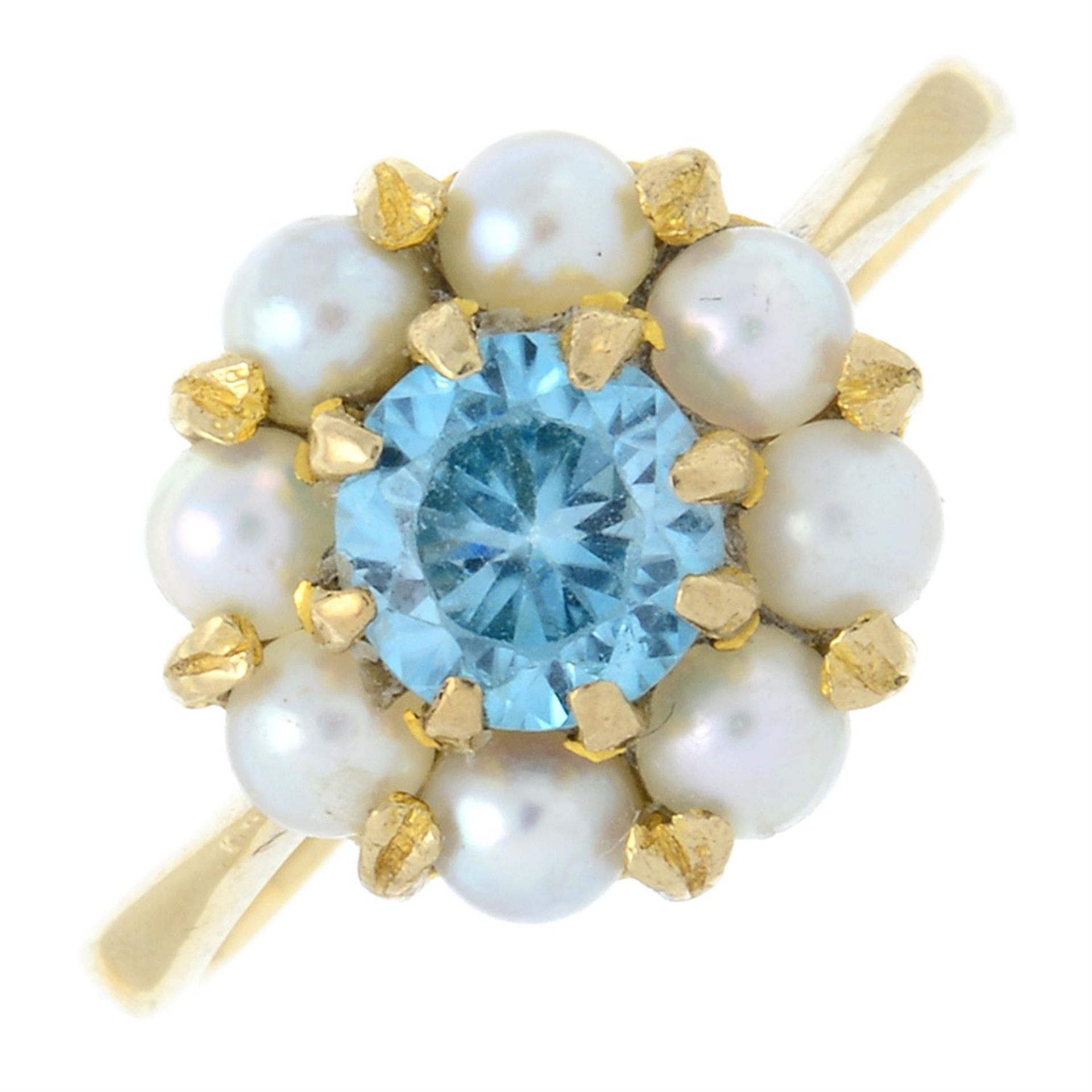 A zircon and cultured pearl ring.