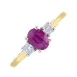 An 18ct gold ruby and brilliant-cut diamond three-stone ring.