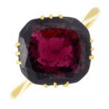 A garnet single-stone ring.