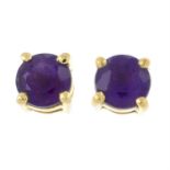 A pair of amethyst stud earrings.