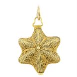 A 19th century gold star locket, with filigree detail.