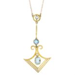 An early 20th century 15ct gold aquamarine and seed pearl drop pendant, with integral 9ct gold