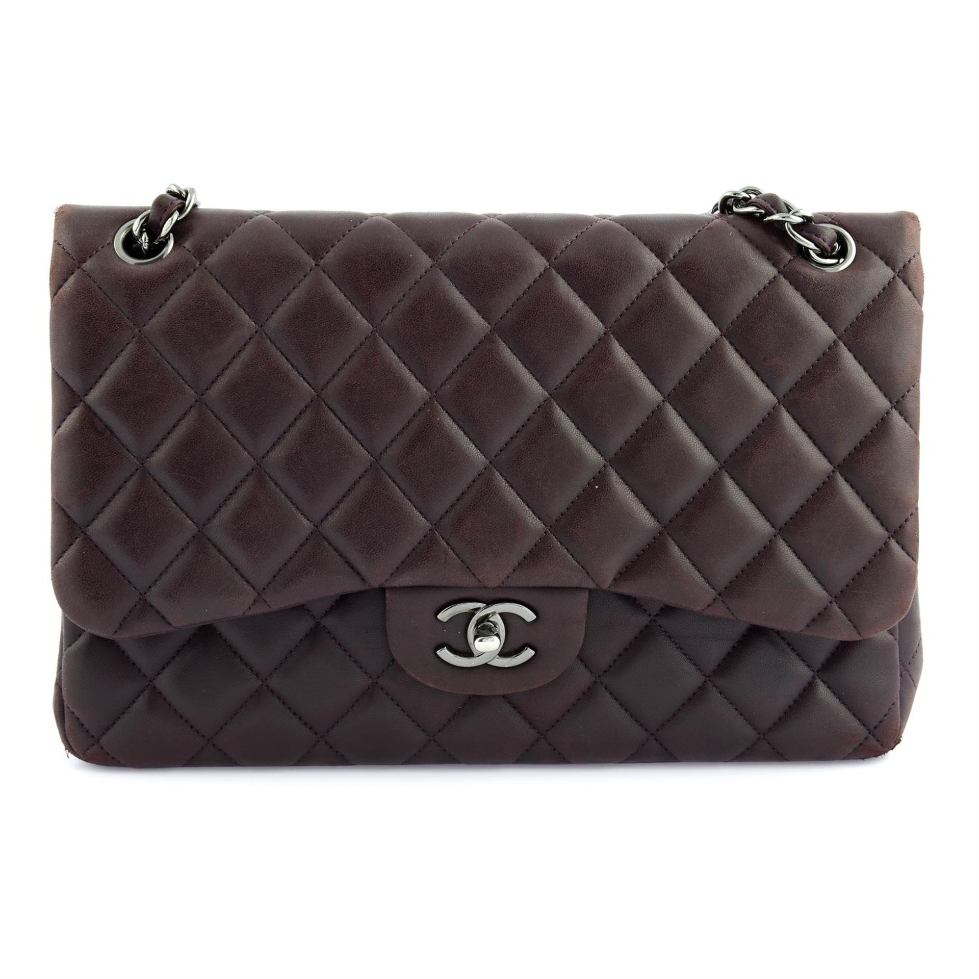 CHANEL- a purple lambskin leather double flap jumbo bag.