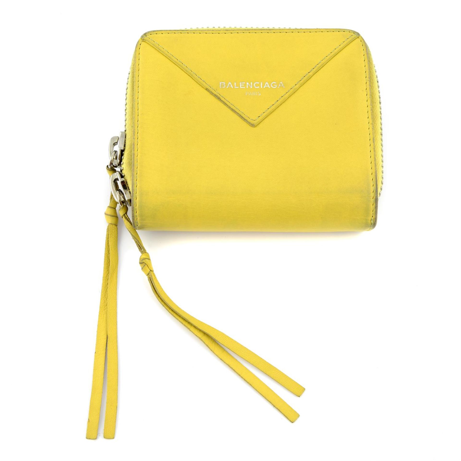 BALENCIAGA - a chartreuse leather compact wallet.