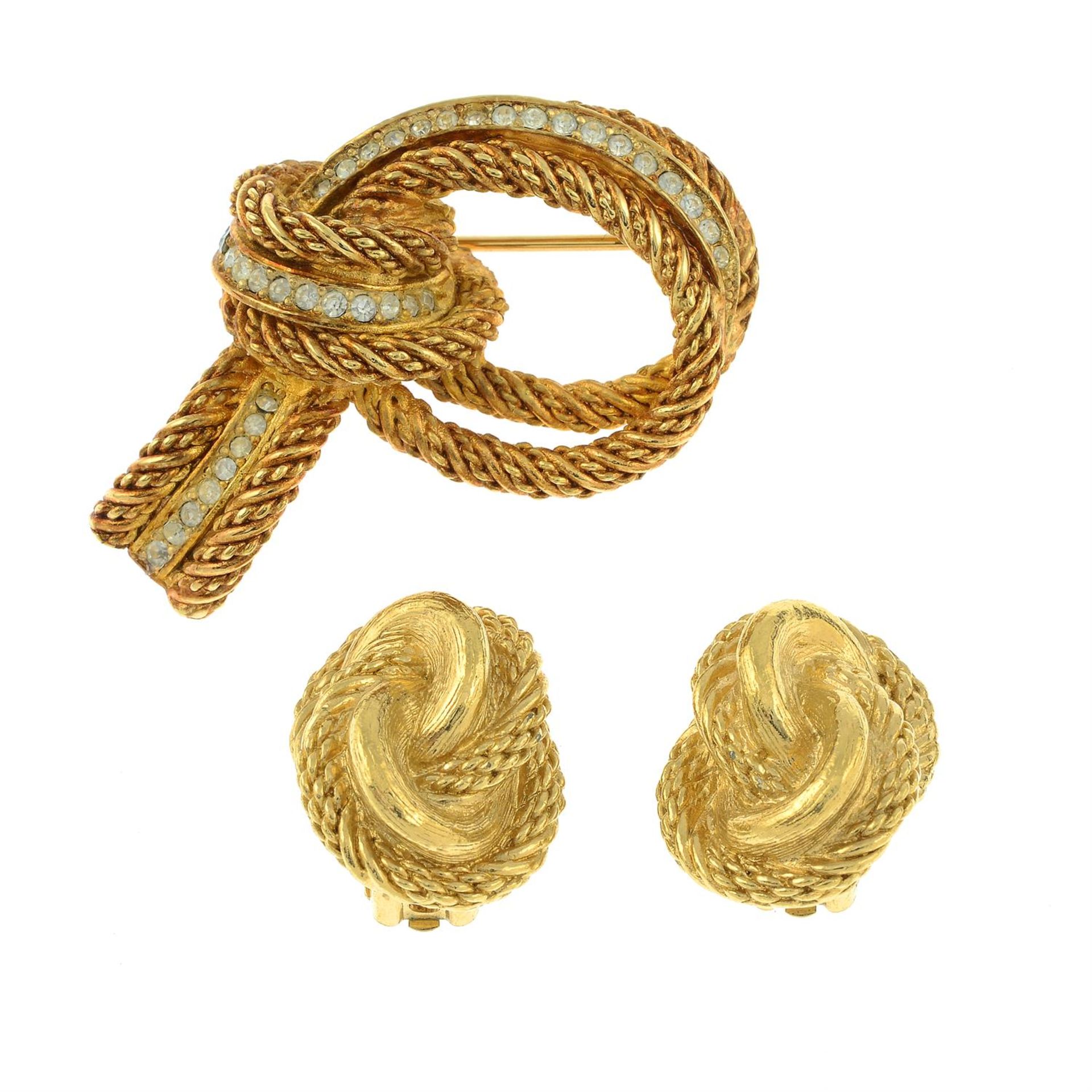 CHRISTIAN DIOR - a knot brooch and a pair of clip-on earrings.