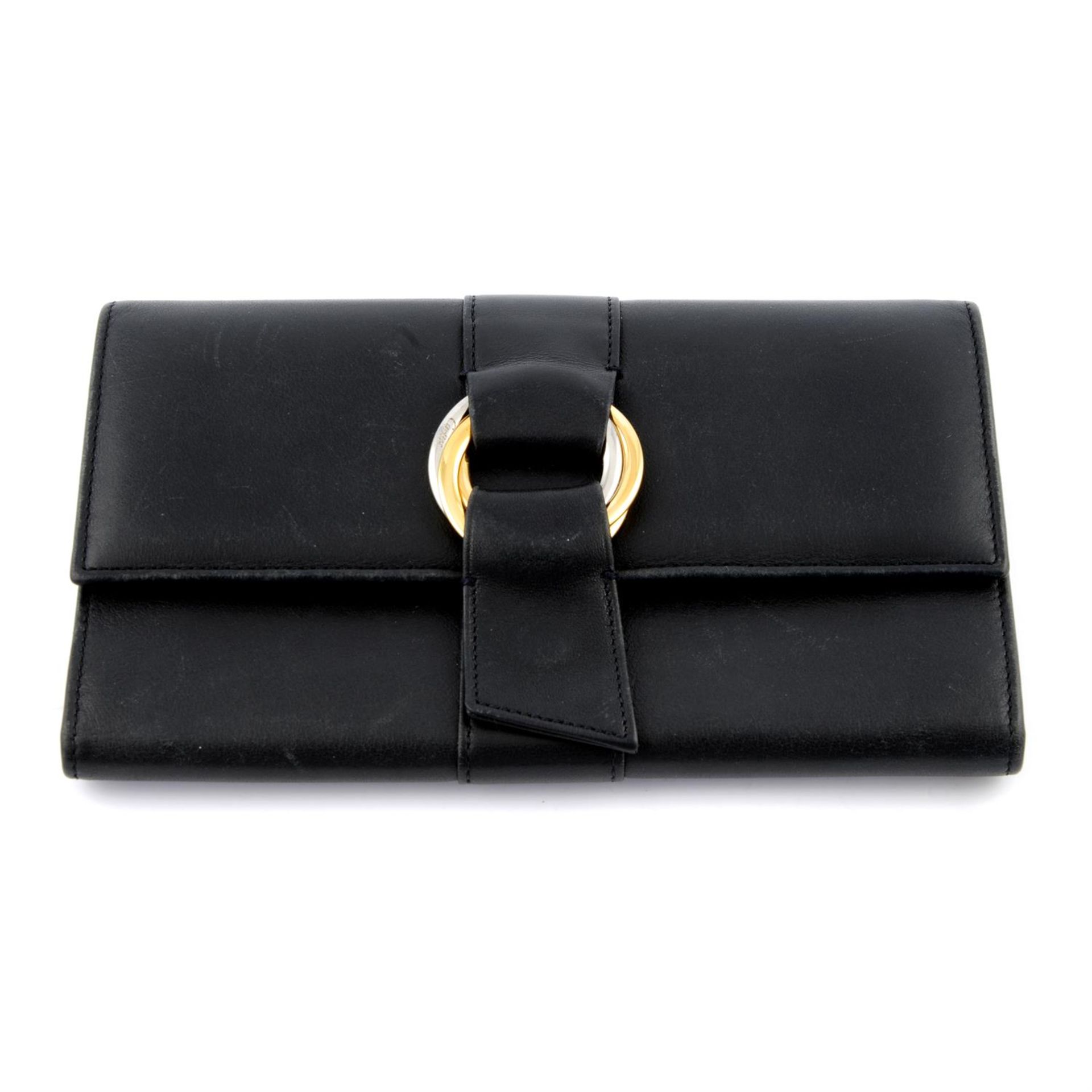 CARTIER - a black leather tri fold Trinity wallet.