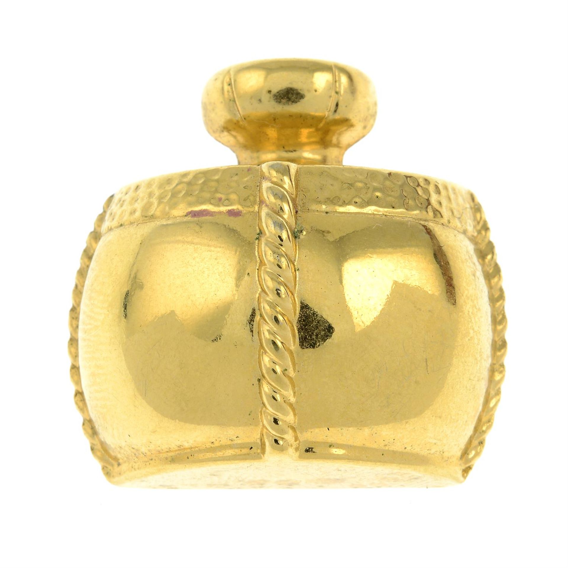 YVES SAINT LAURENT - a brooch, designed as a stylised champagne perfume bottle.