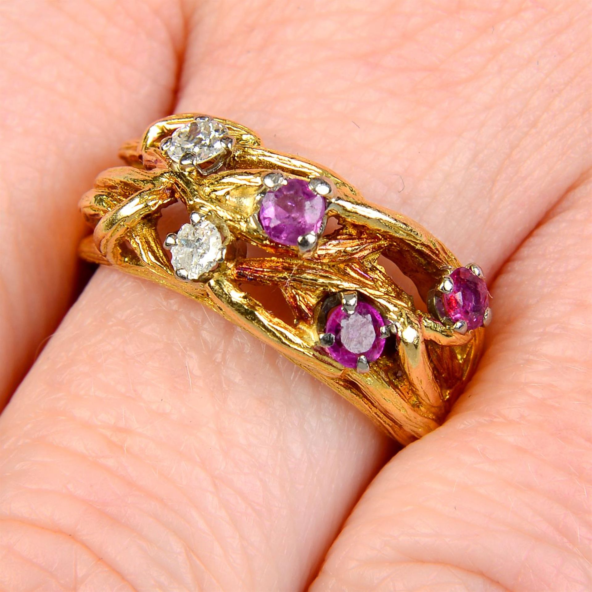 A 1960's 18ct gold textured branching ring, with ruby and old-cut diamond highlights.