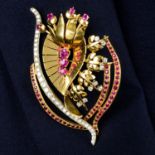 A 1940's gold ruby and brilliant-cut diamond floral brooch.