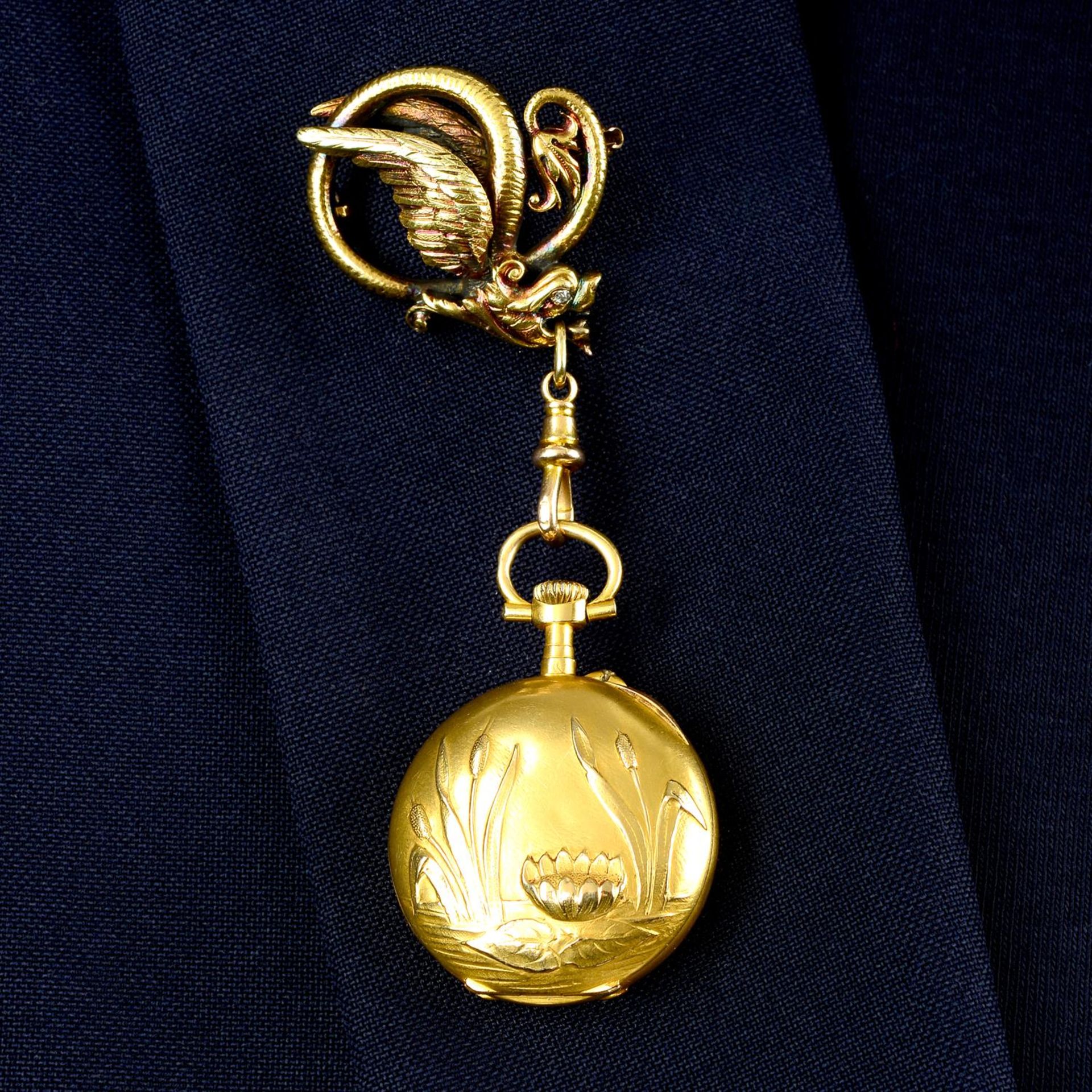 An Art Nouveau 18ct gold fob watch, with embossed lily pad and bullrushes, suspended from a lobster