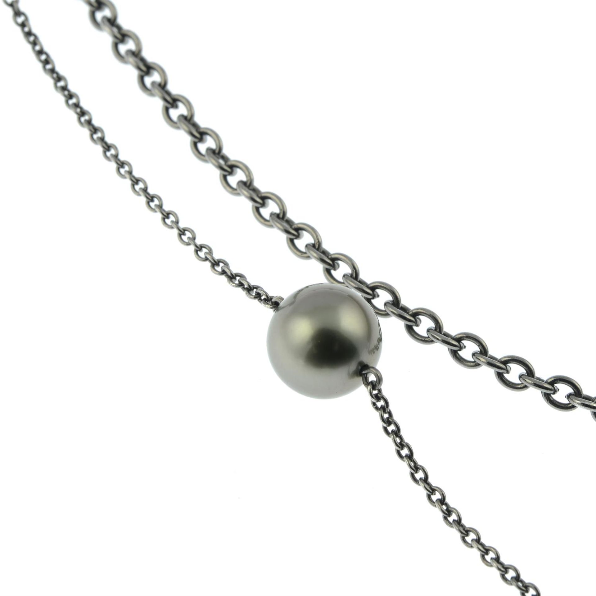 An 18ct gold 'Tahitian' cultured pearl station and plain trace-link two-strand necklace, - Image 4 of 5