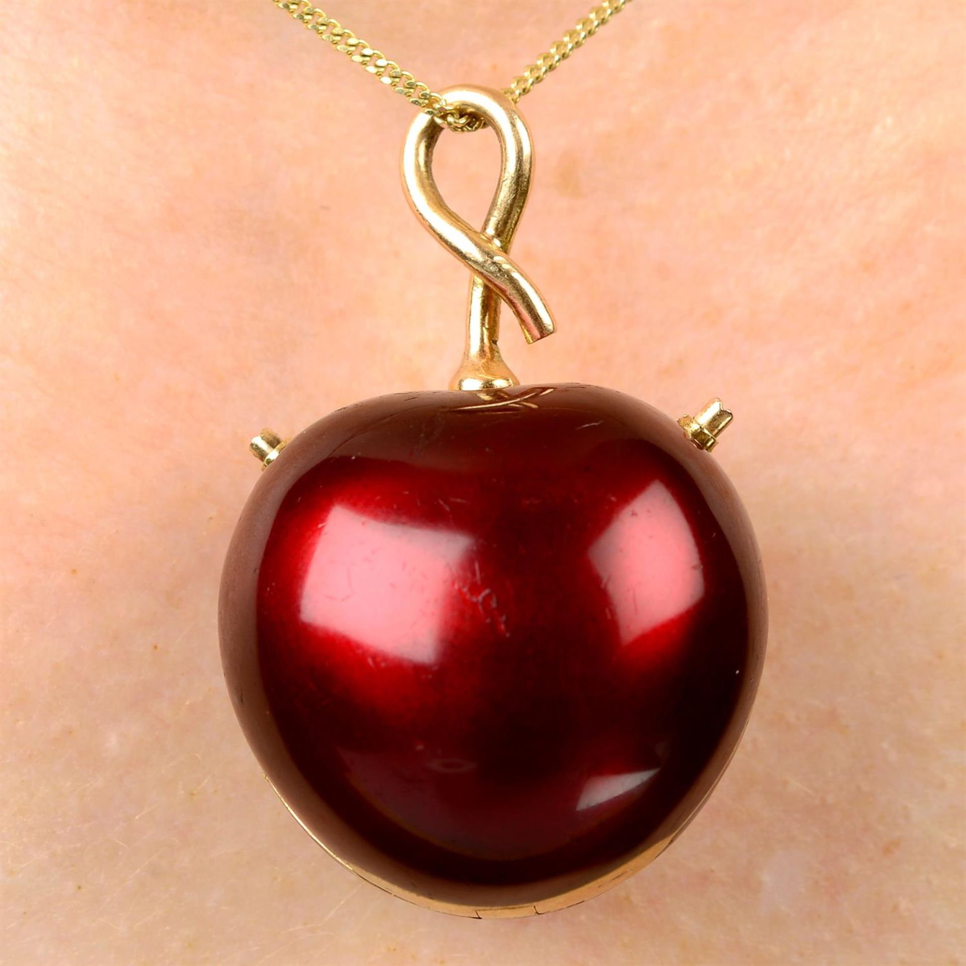 A mid 20th century gold and red enamel cherry fob watch.