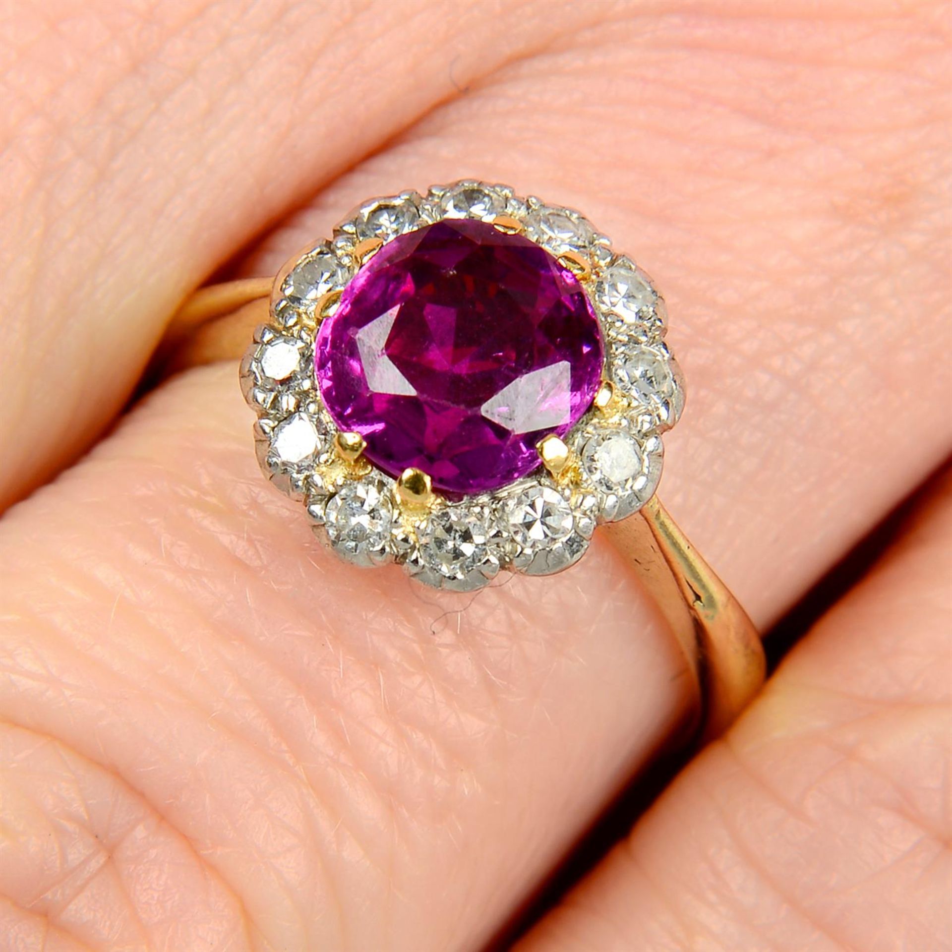 A Sri Lankan pink sapphire and single-cut diamond cluster ring.