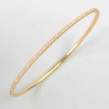 A brilliant-cut diamond 'Lola' bangle, by Kiki McDonough.