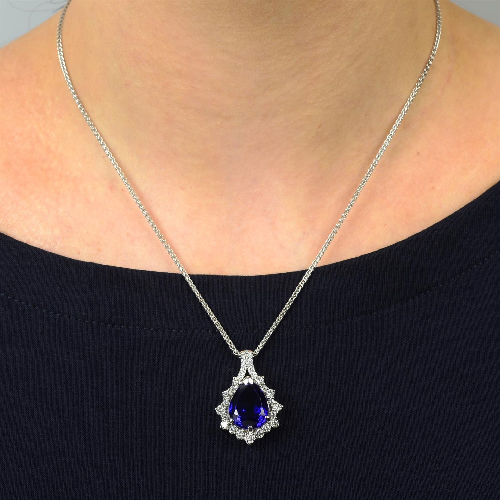 An 18ct gold tanzanite and brilliant-cut diamond pendant, on chain. - Image 5 of 5