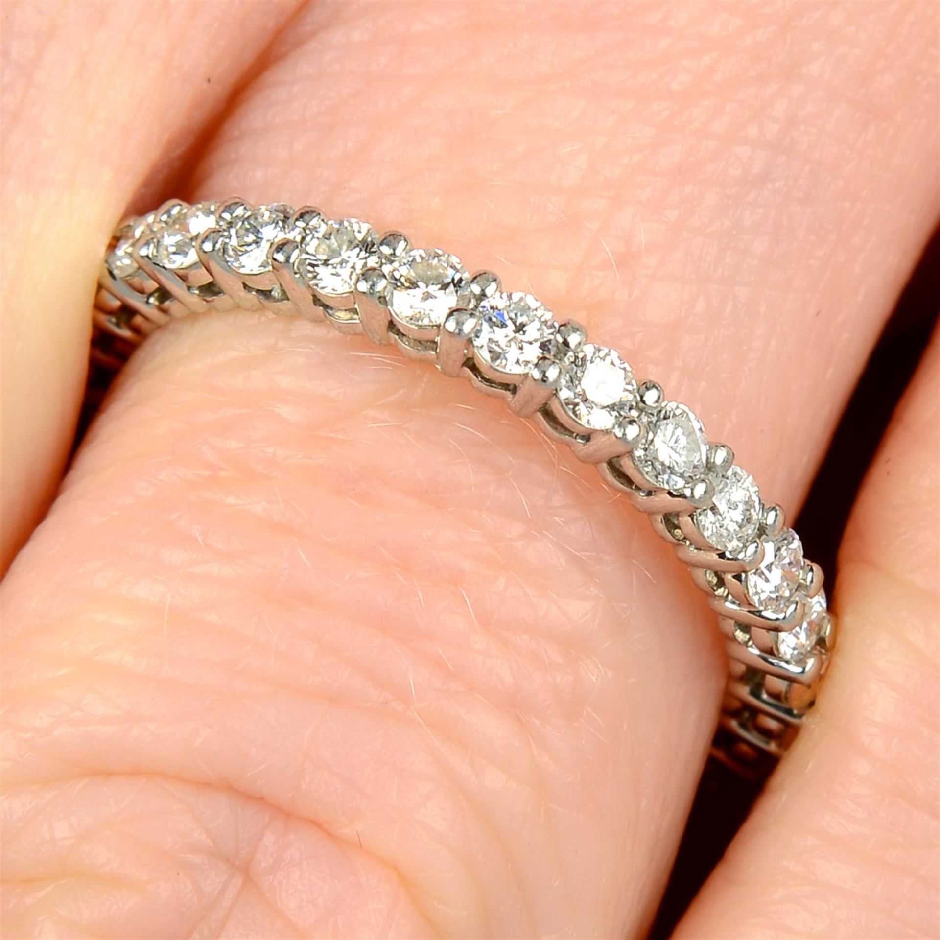A platinum brilliant-cut diamond 'Embrace' full eternity ring, by Tiffany & Co.