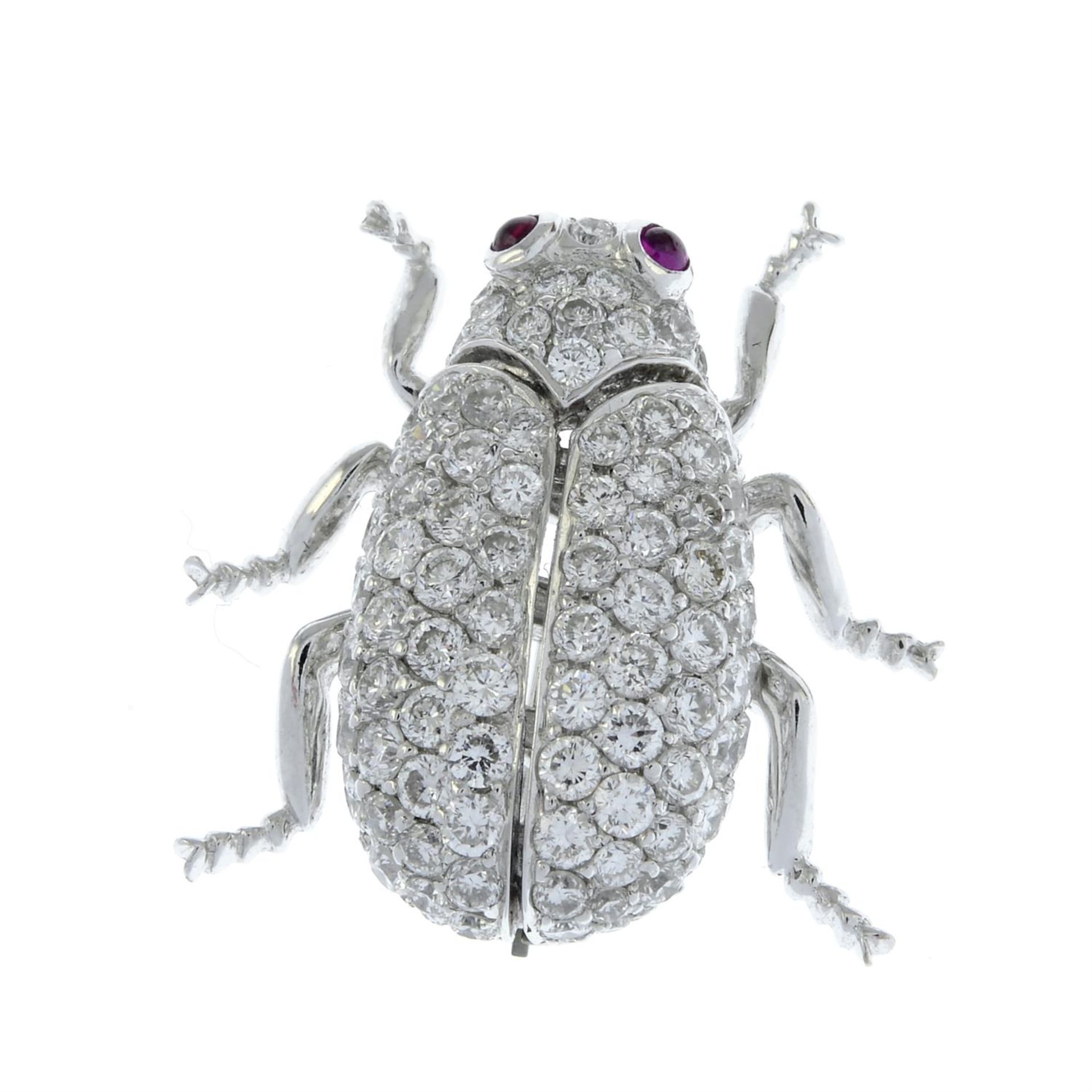 A pavé-set diamond beetle insect brooch, with ruby eyes. - Bild 2 aus 4