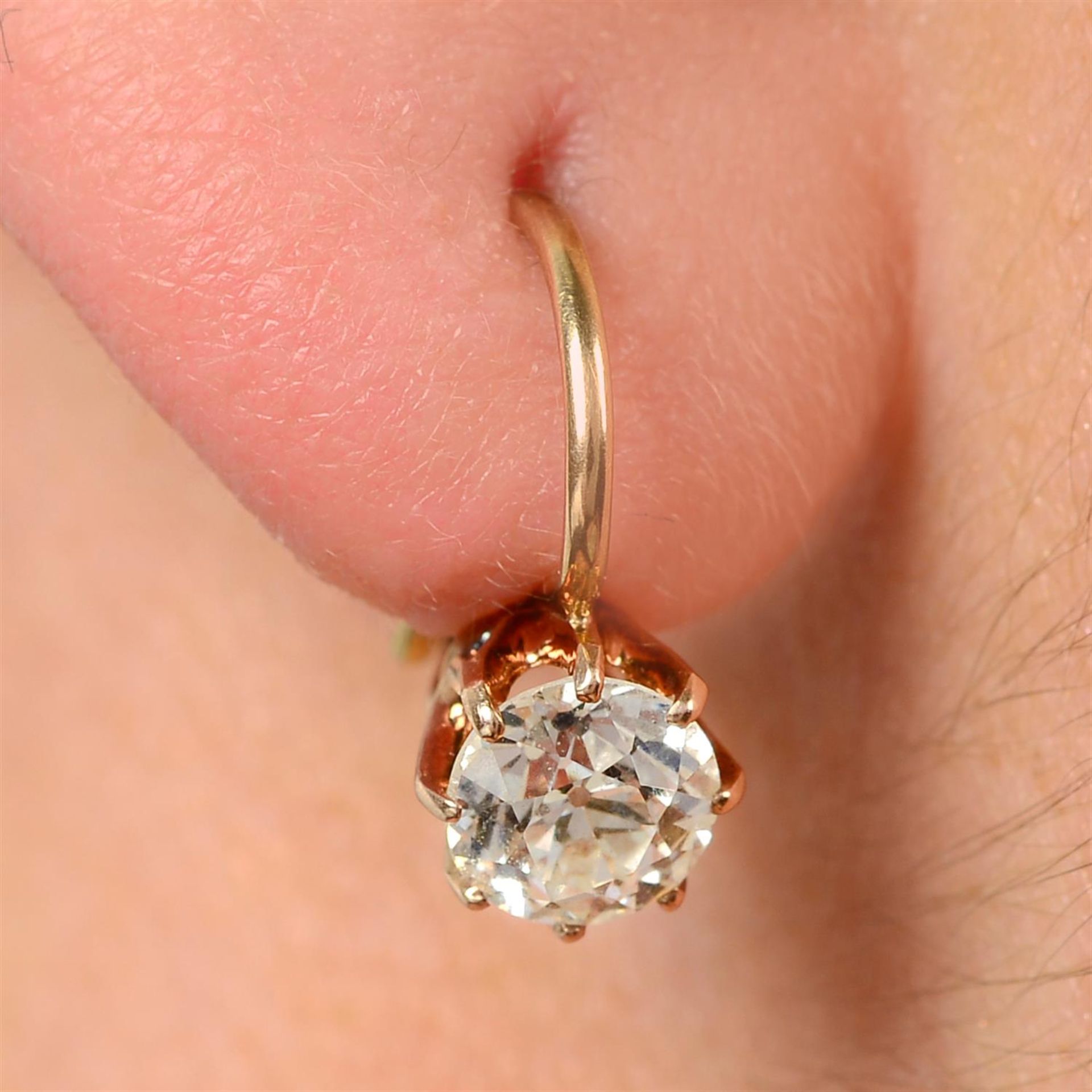 A pair of early 20th century gold old-cut diamond earrings.