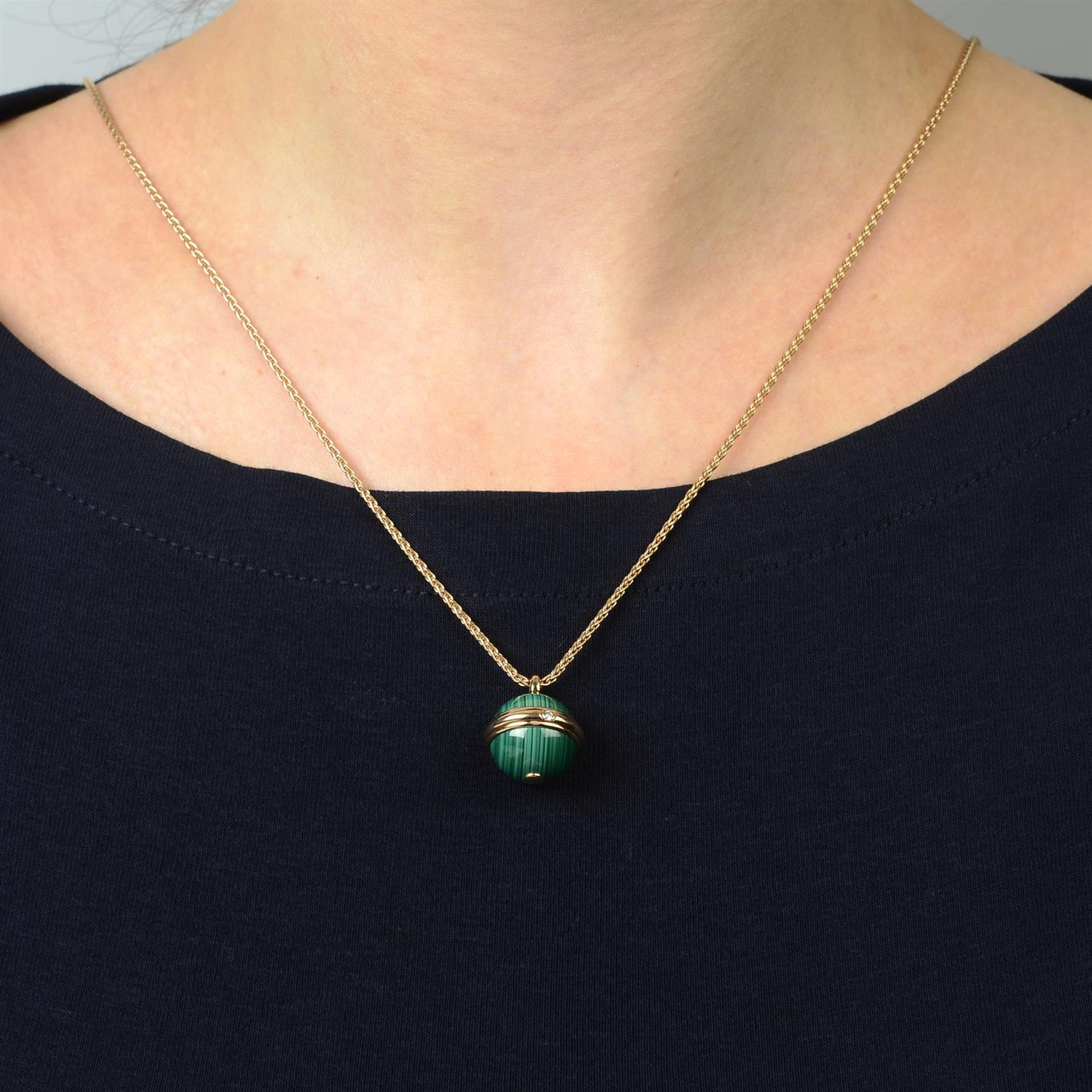A malachite and diamond 'Posession' pendant, on chain, by Piaget. - Image 6 of 6