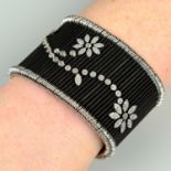 An 18ct gold and black stainless steel, diamond 'Shanghai Flower' bracelet cuff, by Jarretiere.