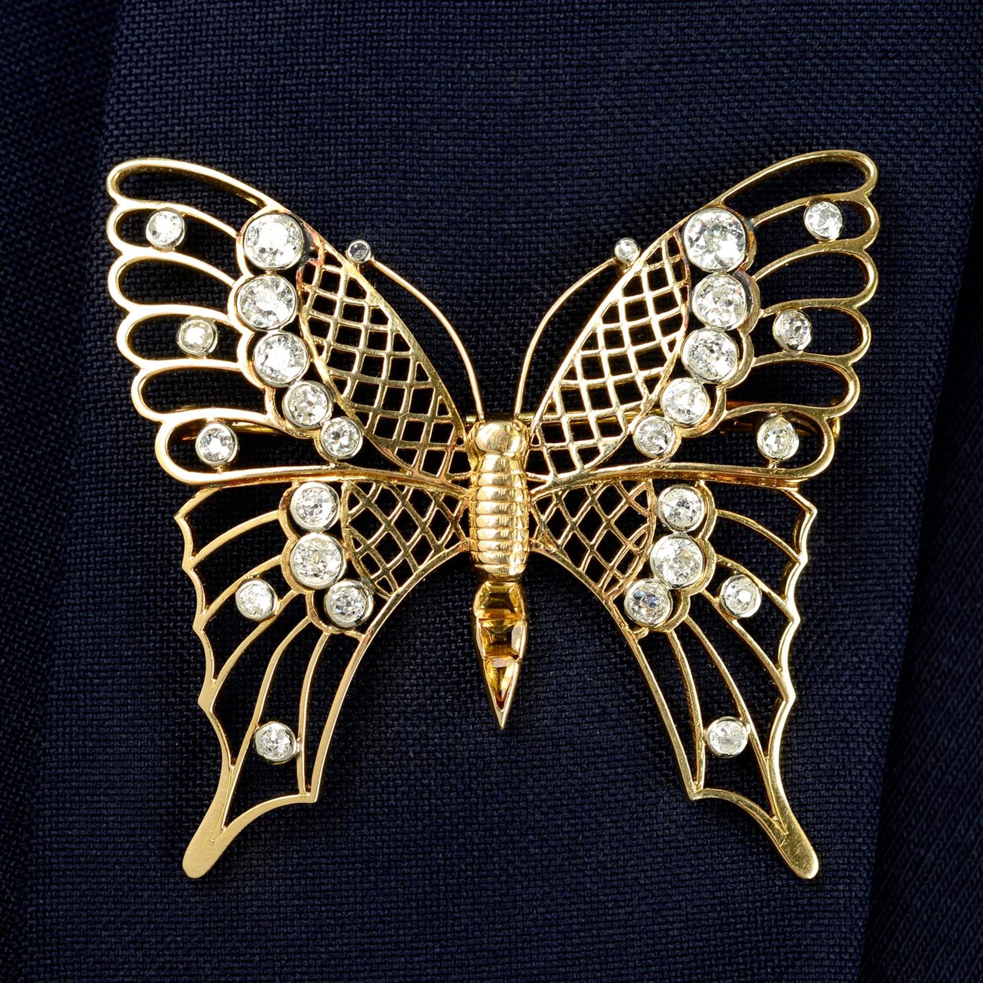 A mid 20th century gold old-cut diamond and citrine openwork butterfly brooch.