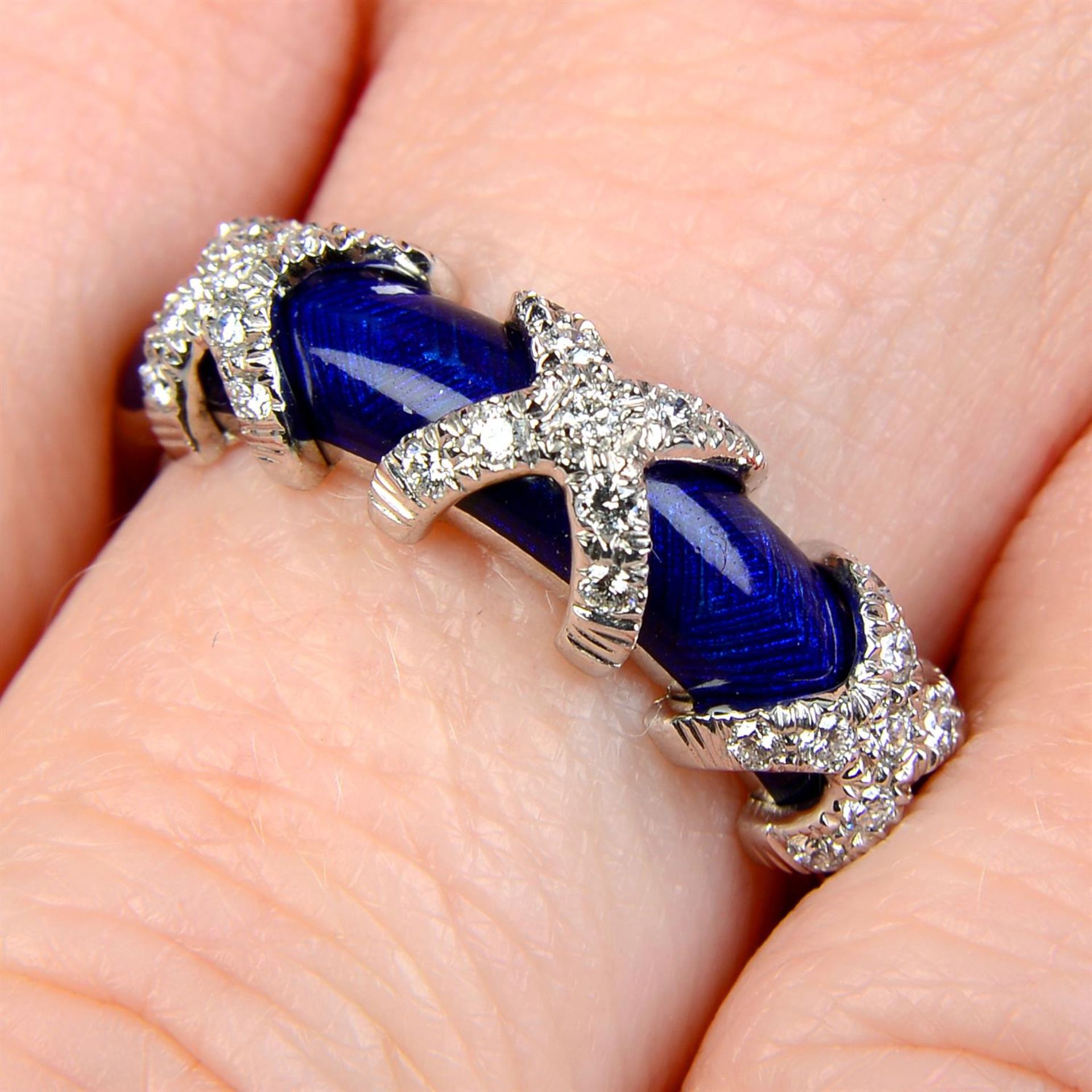 An 18ct gold diamond cross and blue enamel ring, by Fabergé