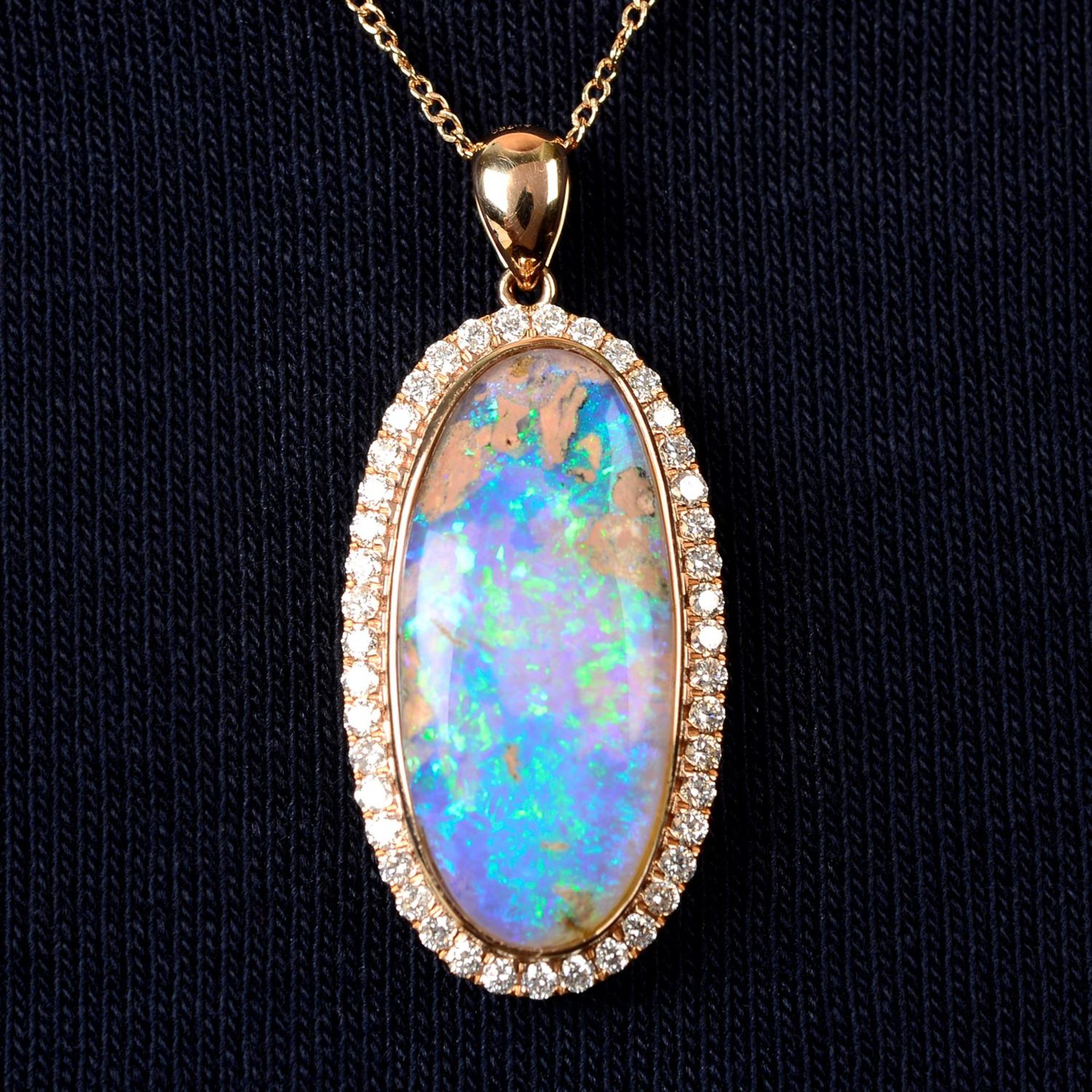 An opal and brilliant-cut diamond cluster pendant, with chain.