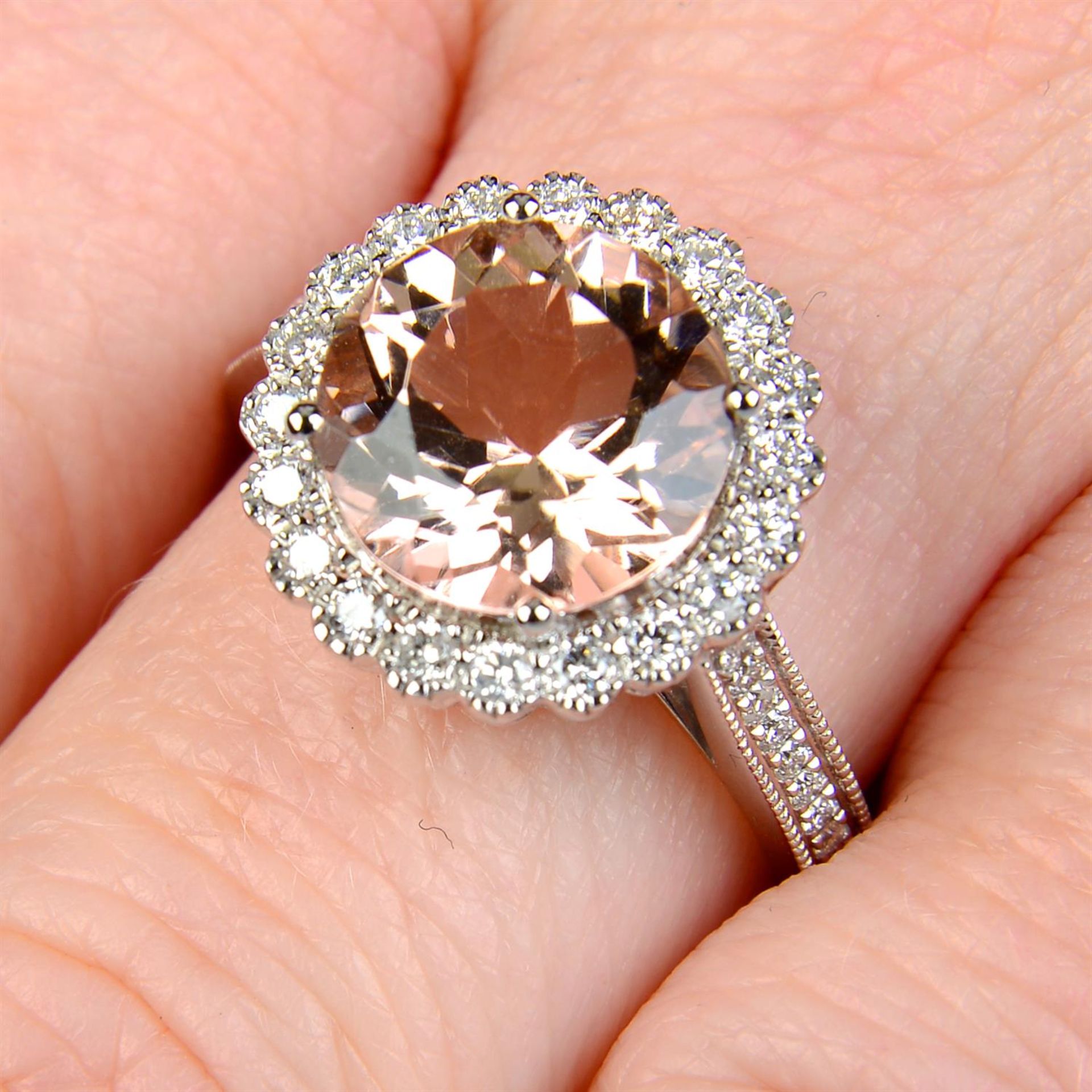 An 18ct gold morganite and brilliant-cut diamond cluster ring.