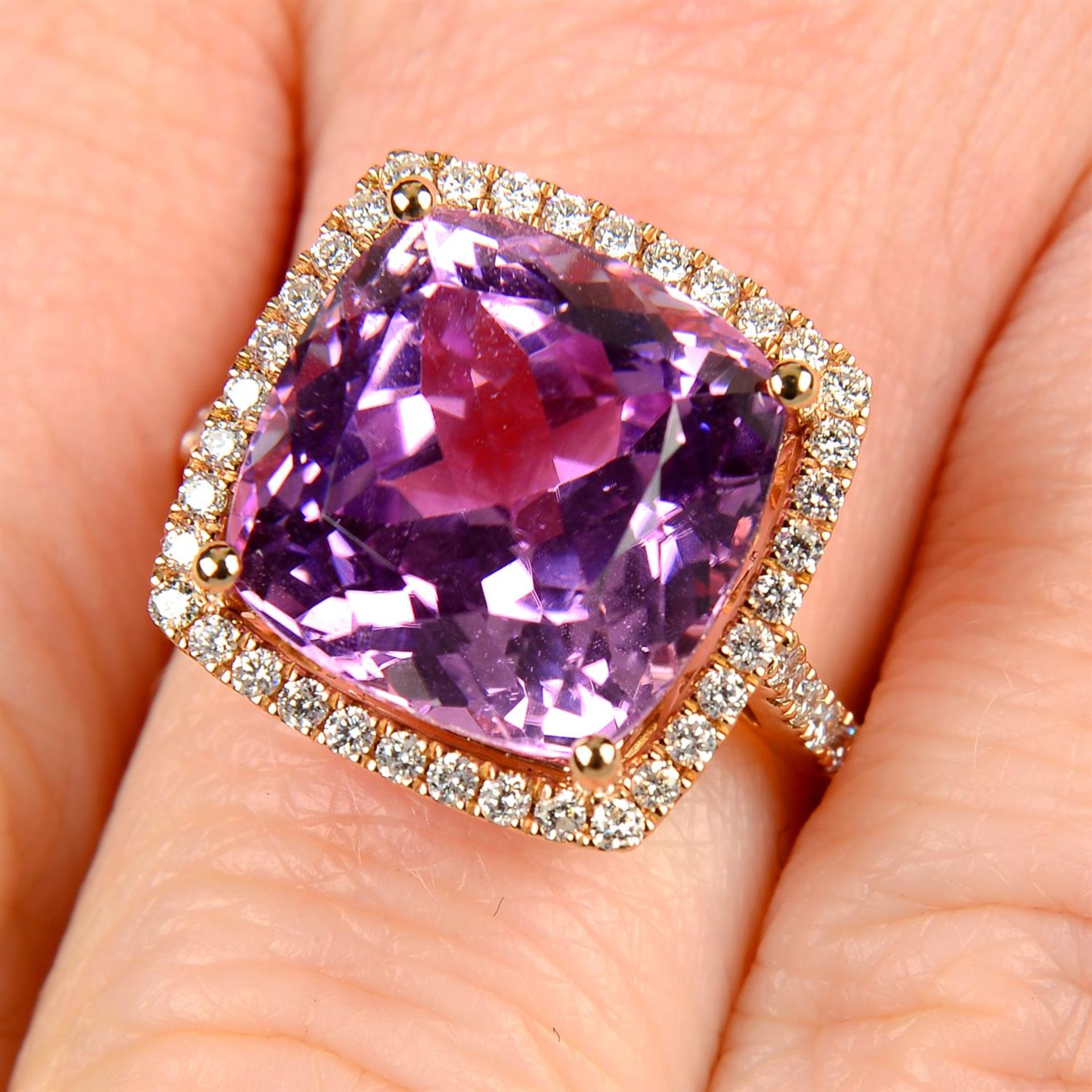 An 18ct gold kunzite and brilliant-cut diamond cluster ring.