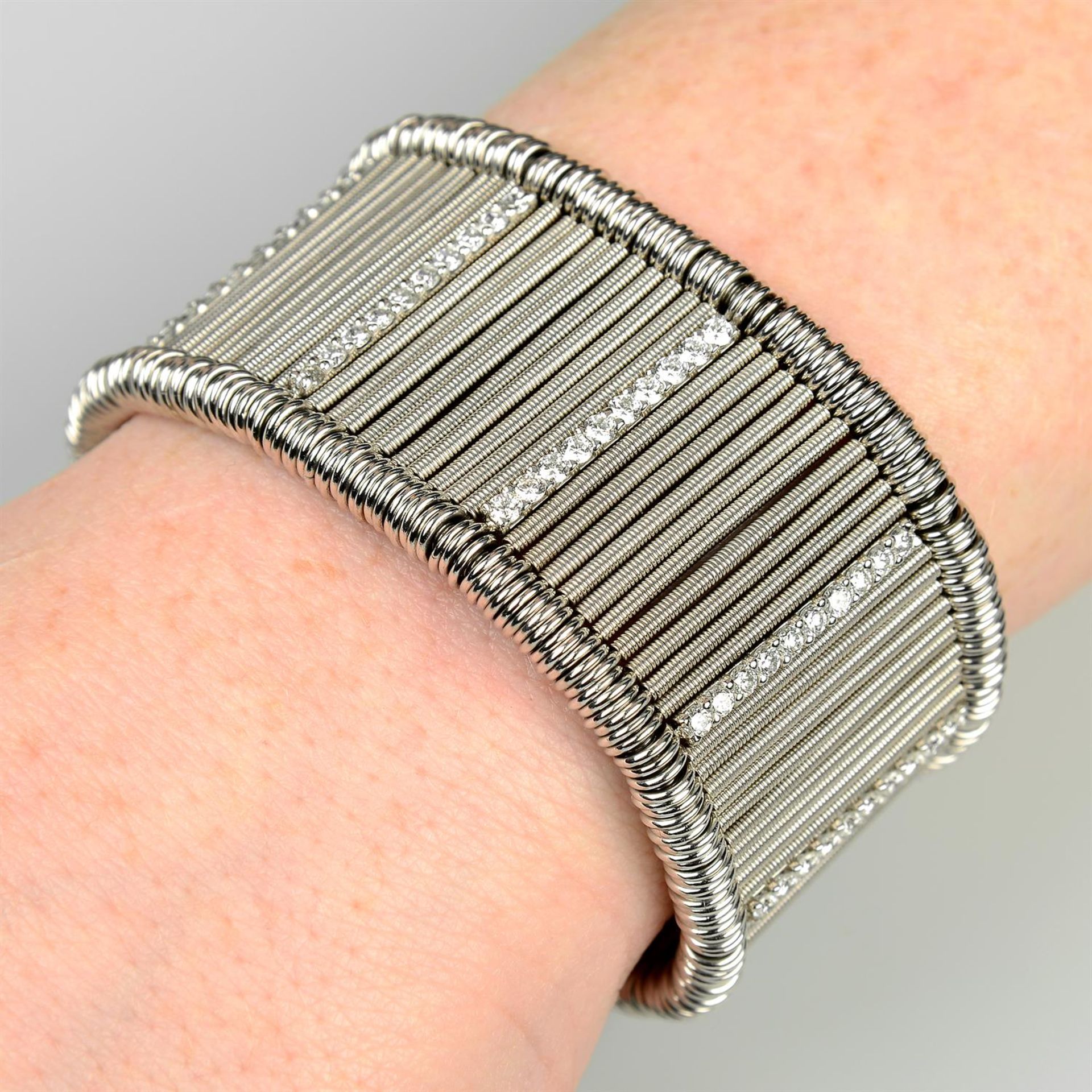 An 18ct gold, stainless steel and brilliant-cut diamond 'Shanghai' bracelet cuff, by Jarretiere.