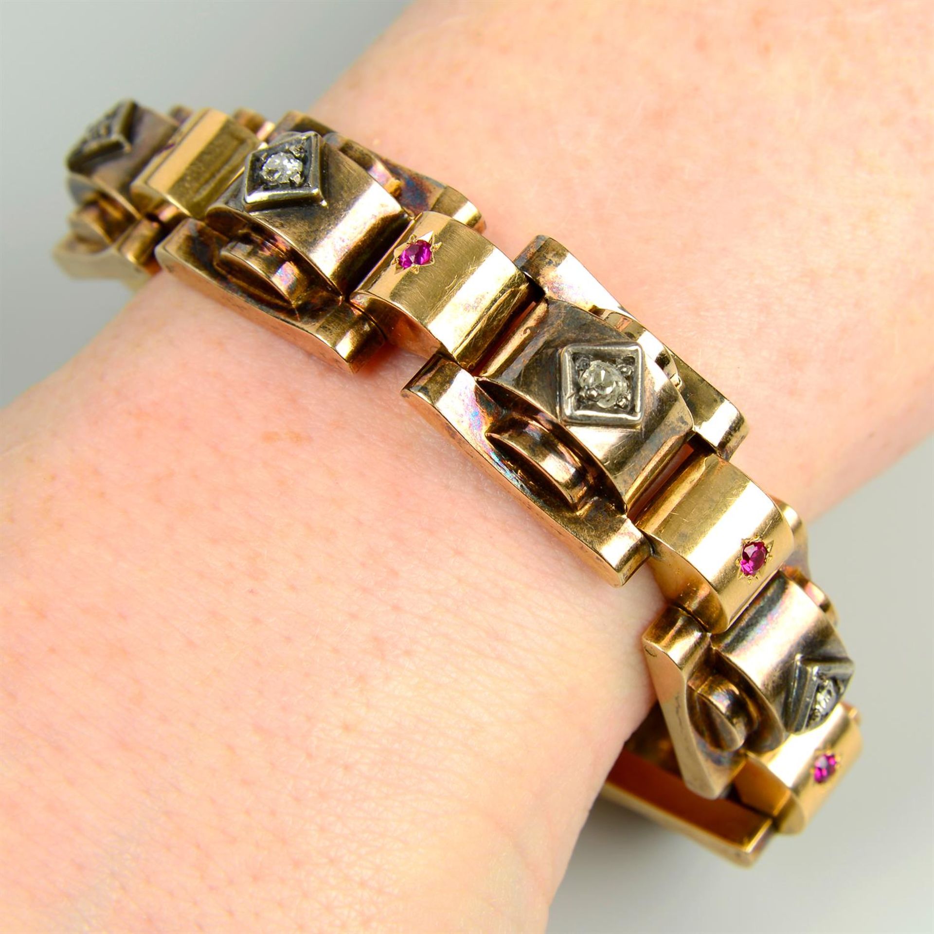 A mid 20th century gold, old-cut diamond and synthetic ruby 'tank' bracelet.